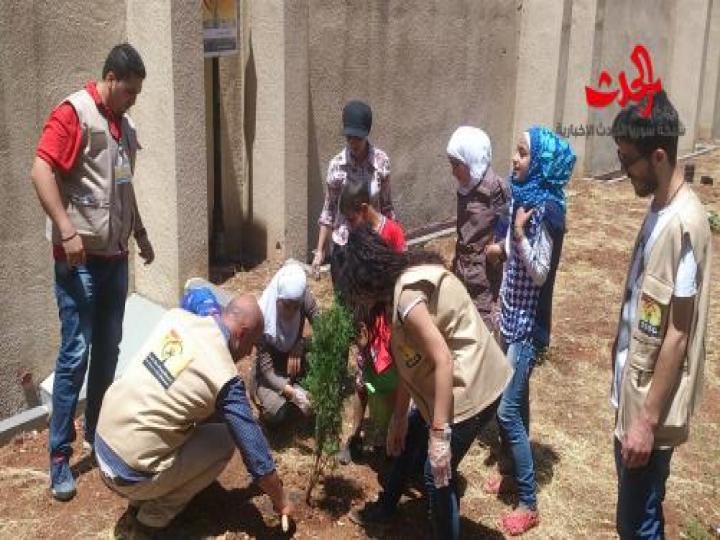 زراعة الأشجار في حديقة المركز الثقافي في حمص بمناسبة اليوم العالمي لمكافحة التصحر 