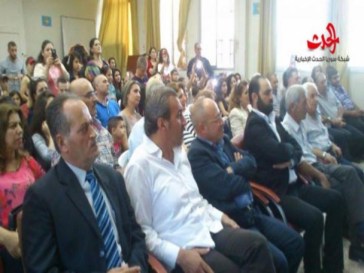 افتتاح مهرجان تشرين في مركز ثقافي الزهراء بحمص 
